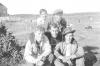 Unknown at Membertou Ball Field. Noel Moores house in background. (Viola Christmas Collection).