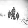 Photo of Joan, Frances and Kenny Doucette, Cecilia Ginnish in back. (Mary Jane Doucette Collection)